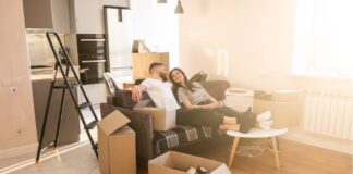 7 Tips for a Stress-Free Relocation Couple sitting and resting on sofa at home