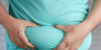 What Most People Get Wrong About Gut Health A Person Holding his Belly Fat