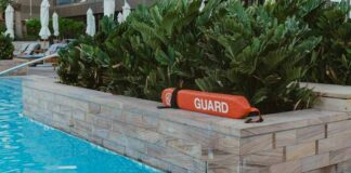 What Pool Operators Get Wrong About Lifeguard Coverage Ratios Lifeguard equipment by the poolside at a modern resort